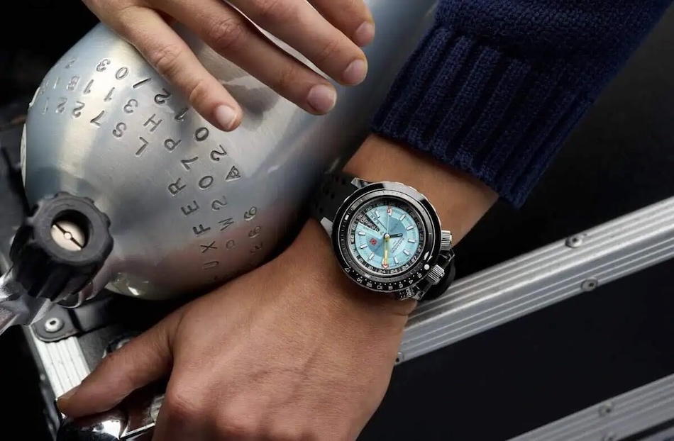 Modern dive watch and scuba tank, essentials for underwater exploration.