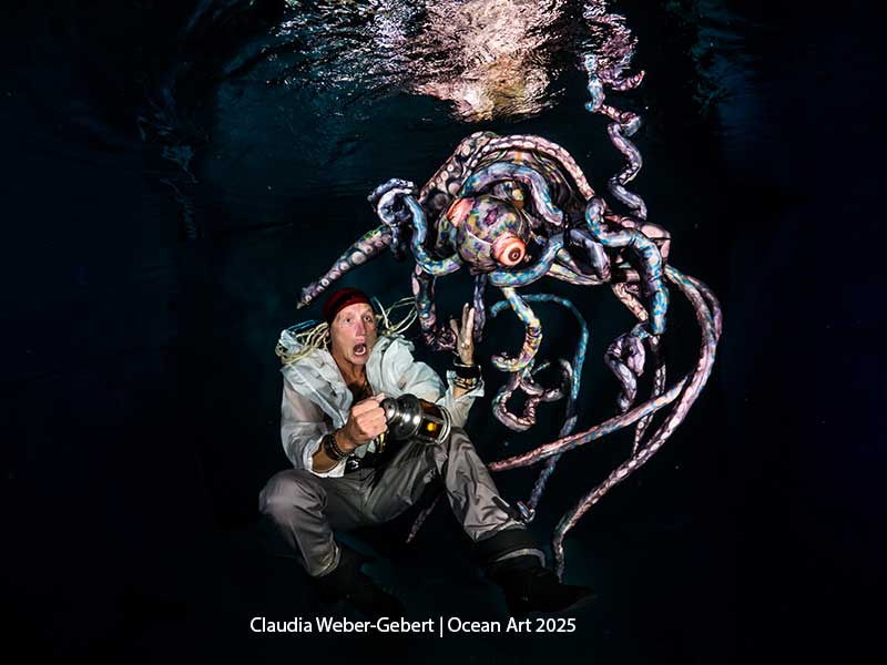An amazed diver interacts with a colorful octopus in the ocean depths.