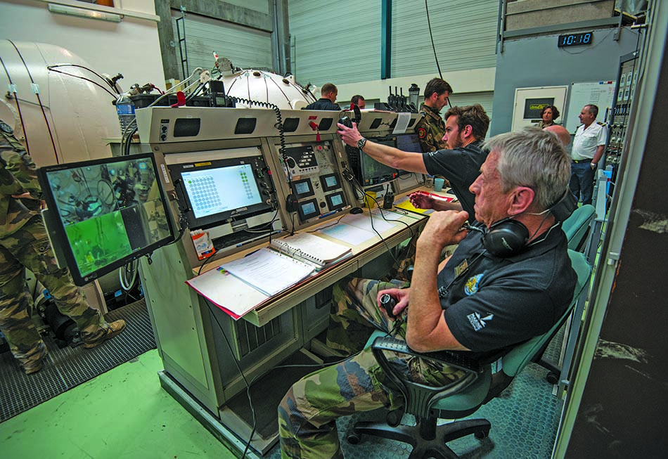 Control center for underwater diving missions with advanced technological equipment.
