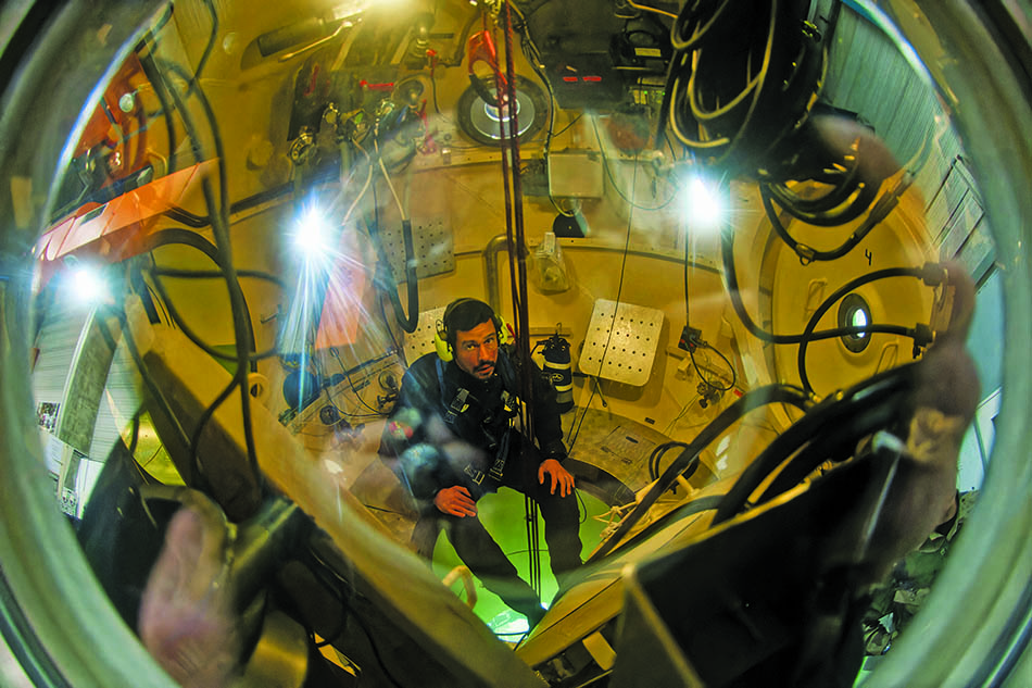Underwater exploration in a submersible, revealing the importance of scientific diving.
