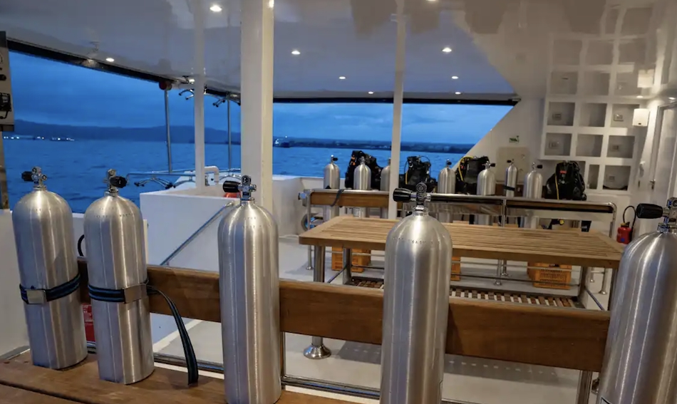 Ready-to-use diving equipment on a boat, ideal for exploring underwater wonders.