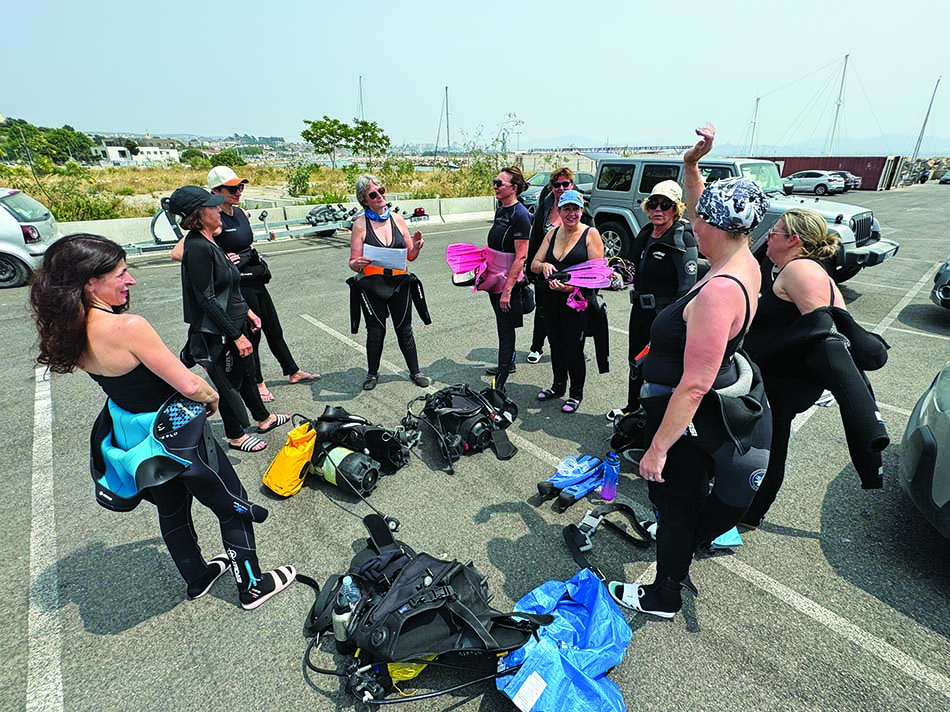 A group of divers prepares to explore underwater wonders.