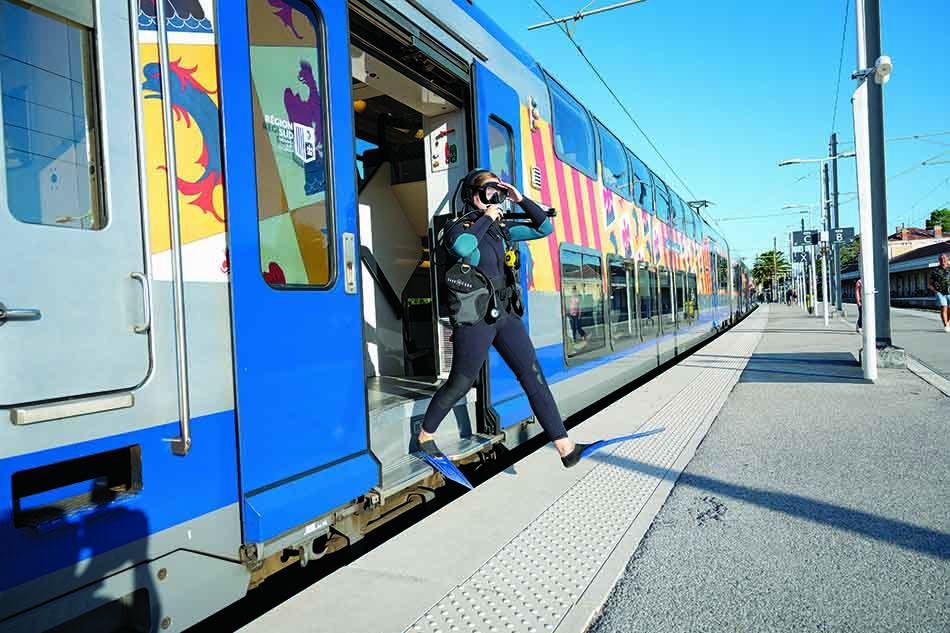 Diver ready to explore the underwater wonders after leaving the train.