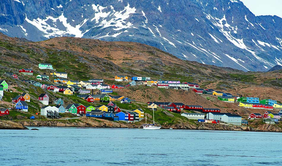 Colorful seaside village, ideal for diving and underwater exploration.